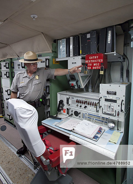A park ranger at the underground launch control center for Minuteman II missiles  the site was deactivated after the Cold War  National Historic Site  Cactus Flat  South Dakota  USA