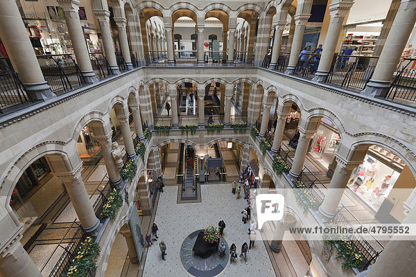 Arcades in the inner courtyard of Magna Plaza shopping centre in the former building of the Main Post Office  Nieuwezijds Voorburgwal  Amsterdam  Holland  Netherlands  Europe