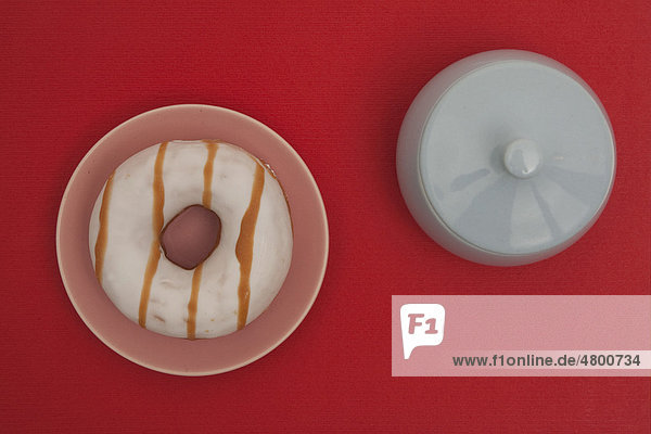 Donut and sugar bowl