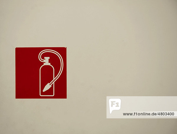 Pictogram of a fire extinguisher on a wall