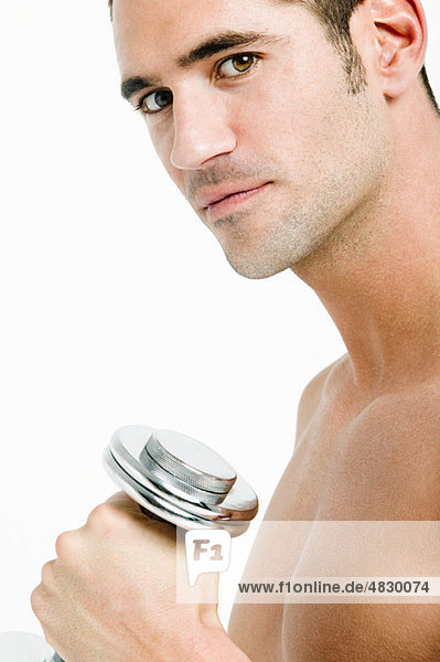 Young man with hand weights