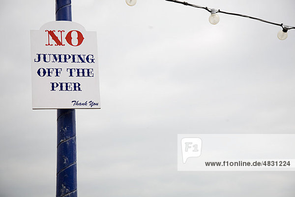 Warning sign on pier