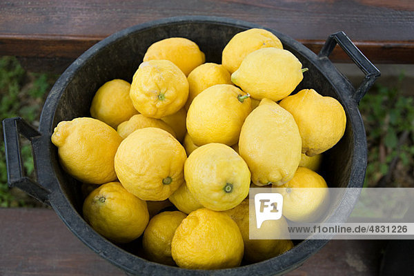 Bucket of fresh lemons