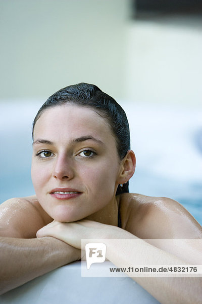 Woman relaxing in bathtub  portrait