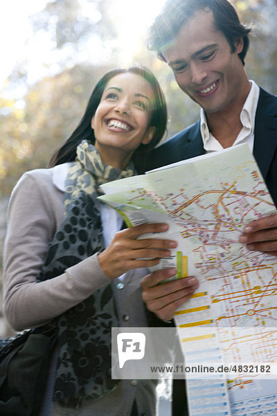 Couple sightseeing together  consulting map