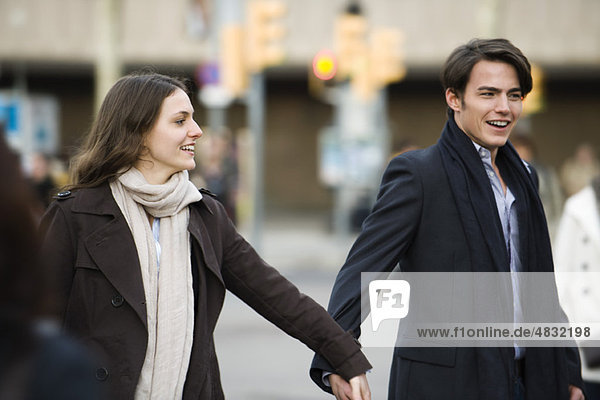 Couple walking hand in hand