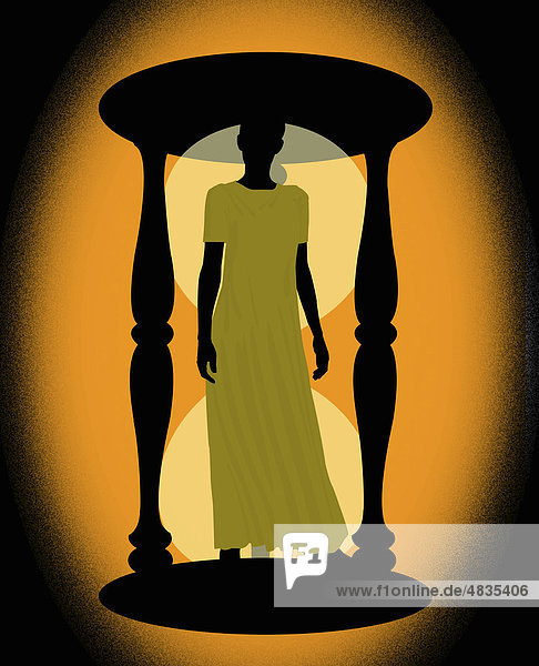 Woman standing inside hourglass