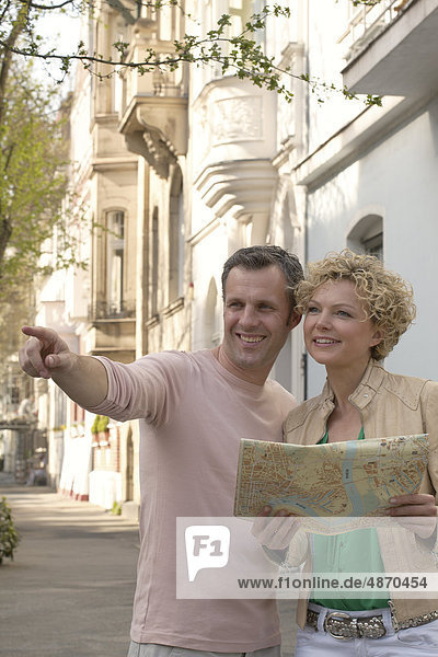 Mature couple with city plan