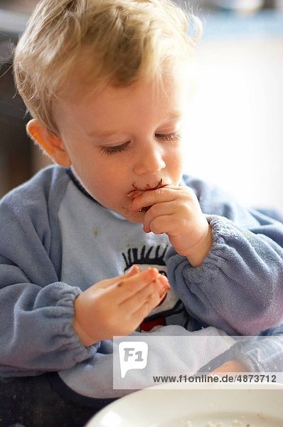 baby eating from plate
