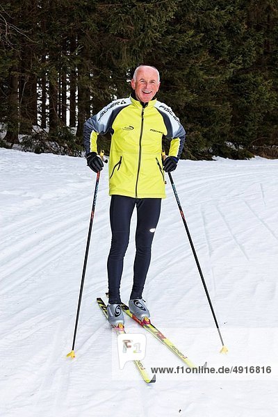 Senior in winter on snow cross_country skiing