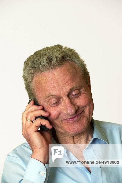 delighted man talking on a mobile phone