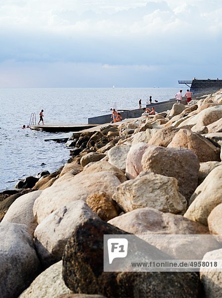 Coastline with stones and pier