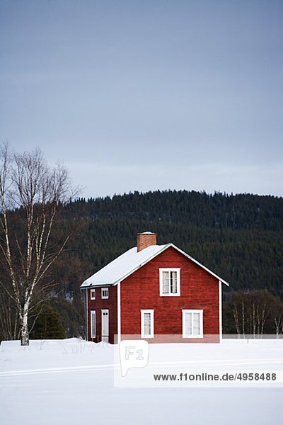 A red wooden house  Norrland  Sweden.