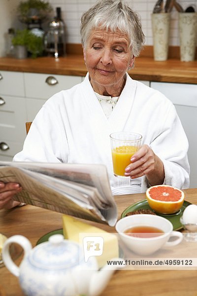 An elderly woman having breakfast  Sweden.