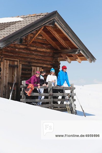 Italy  Trentino-Alto Adige  Alto Adige  Bolzano  Seiser Alm  People standing outside ski resort near railings