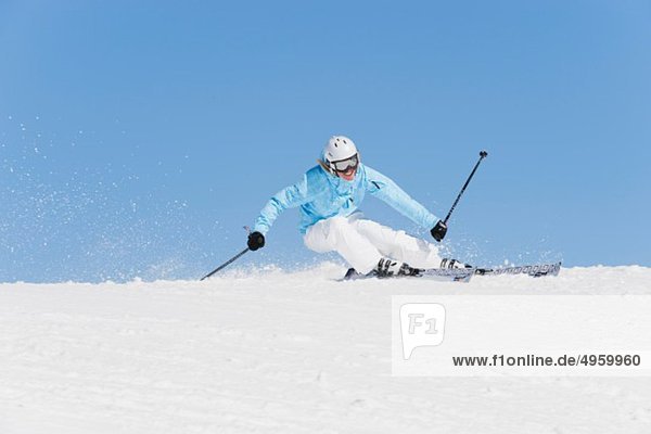 Italy  Trentino-Alto Adige  Alto Adige  Bolzano  Seiser Alm  Young woman skiing