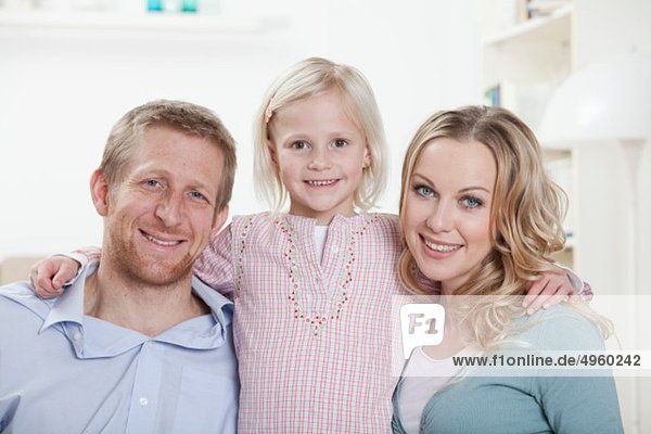 Germany  Bavaria  Munich  Daughter and parents at home  smiling  portrait