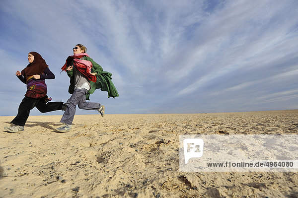Iran  Yazd  Iranian Young People Running in the Desert