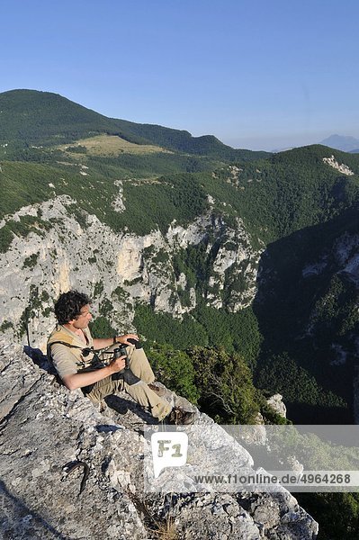 Italy  Marche  Gola del Furlo  Canyon Furlo Gorge  Man whit Binoculars
