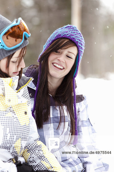 Teen girls in snowboard clothing