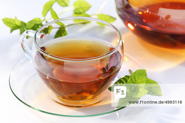 Glass of tea and mint leaf