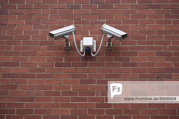 Video surveillance cameras on a wall