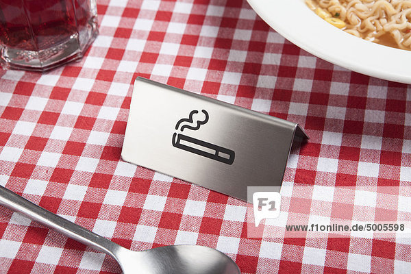 A smoking sign on a restaurant table