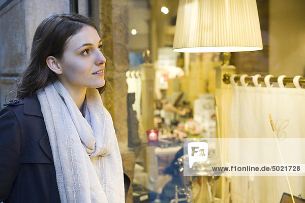 Young woman window shopping