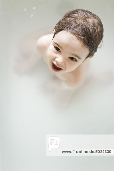 Toddler boy taking a bath  portrait