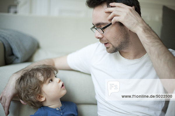 Father talking to young son  portrait
