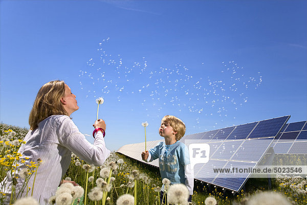 Mother and son with solar panels