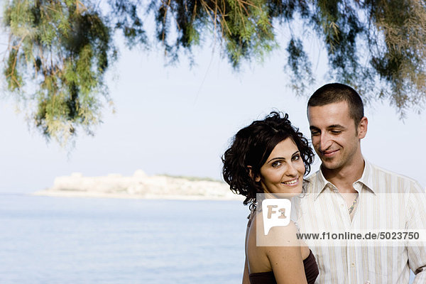 Couple smiling together on waterfront