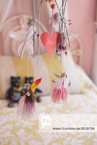 Close-up of wind chime decorated in a bedroom