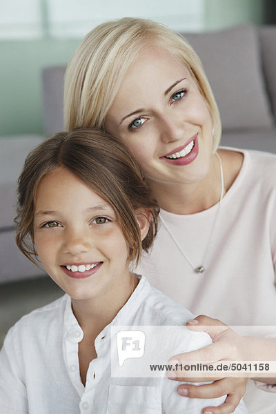 Portrait of a woman smiling with her daughter