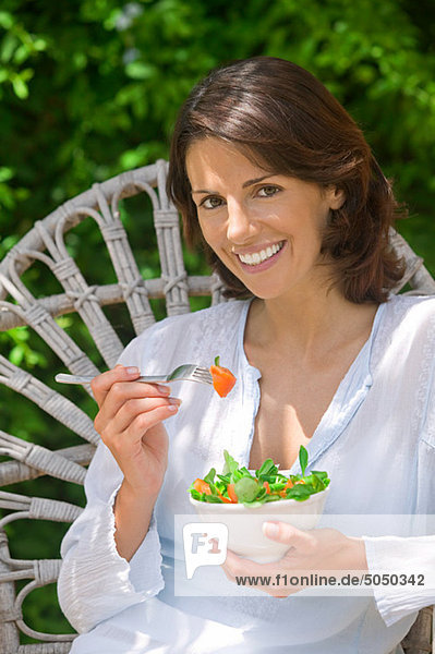 Woman with a bowl of salad