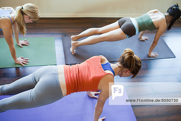 Three woman doing yoga class