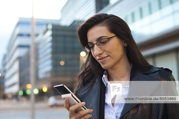 Businesswoman using cell phone  portrait
