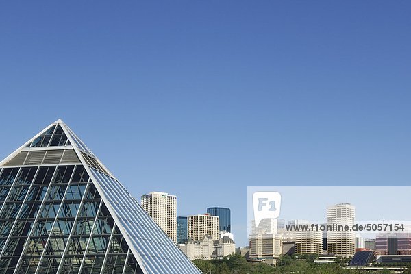 Edmonton skyline with the glass pyramid at the Muttart Conservatory in the foreground - Edmonton  Alberta
