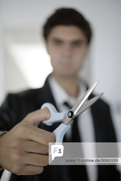 Man holding scissors