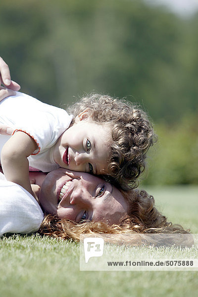 Mother and daughter cheek to cheek
