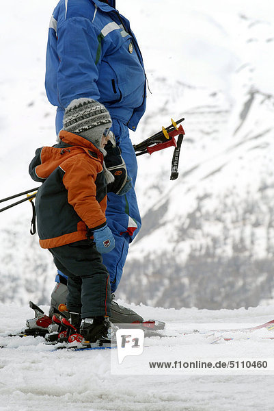 Father and son in skiing gear