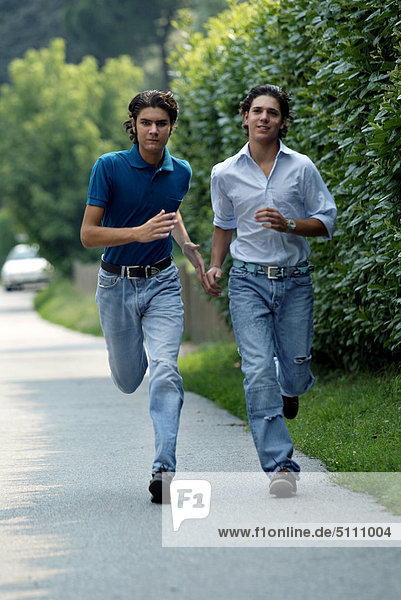 Teenage boys running