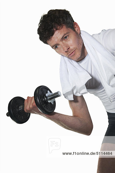 Low angle view of man lifting weights
