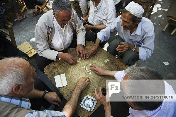 Turkey  Urfa  Bazaar  in the open court of a tea house  men play domino