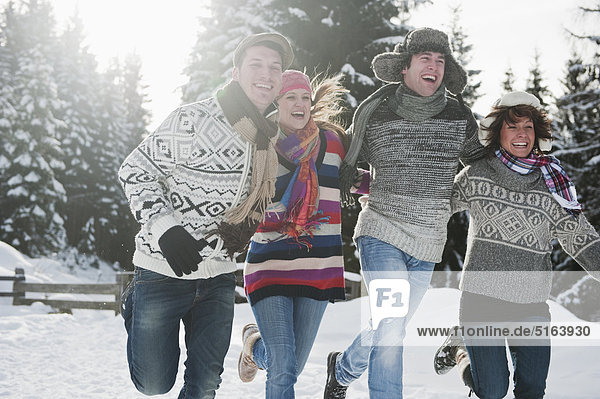 Austria  Salzburg Country  Flachau  Young people having fun in snow