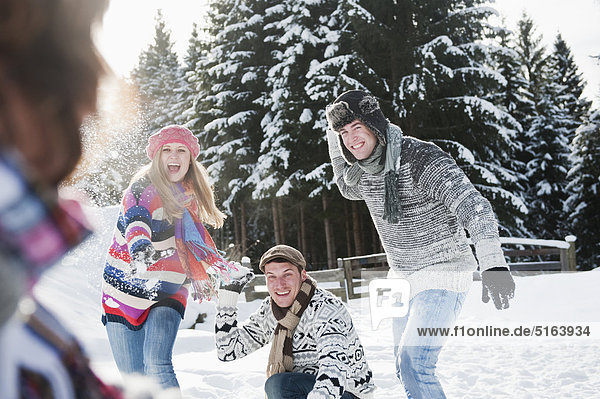 Austria  Salzburg Country  Flachau  Young people snow fighting in snow