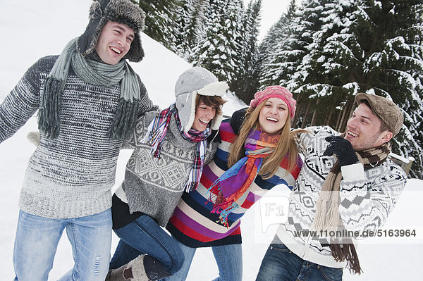 Austria  Salzburg Country  Flachau  Young people having fun in snow