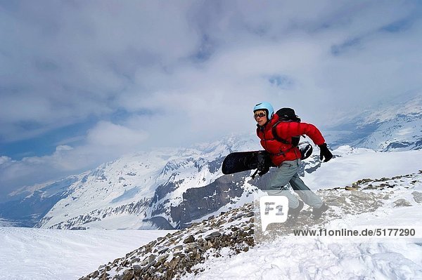 A snowboarder sprinting to be first to get the fresh lines