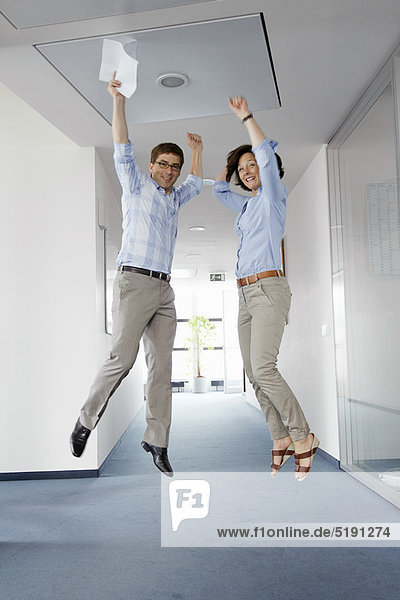 Business people jumping for joy