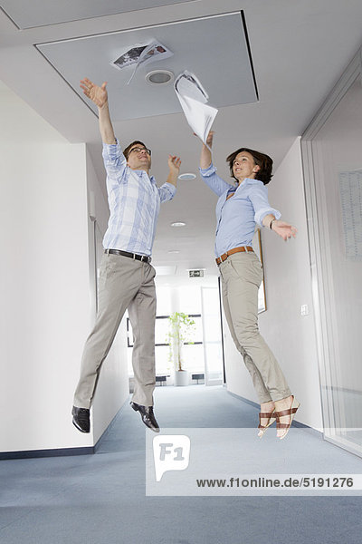 Business people jumping for joy